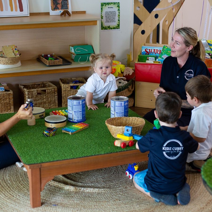 A group of children in a playroom.